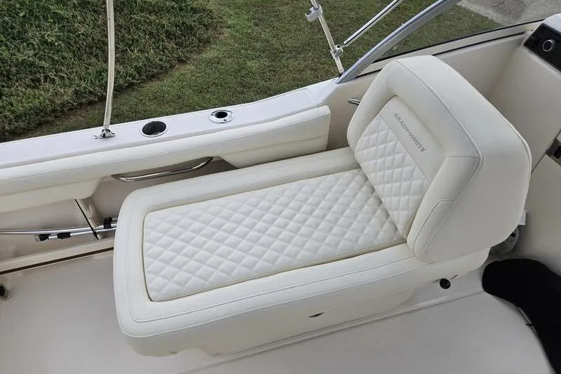 Slide: The Image of 2026 Grady-White Freedom 215 boat seat with quilted white upholstery. - 22
