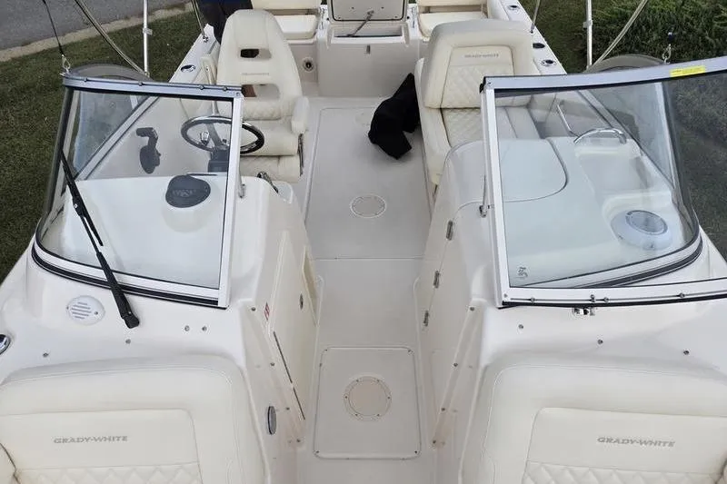 Slide: The Image of 2026 Grady-White Freedom 215 boat interior with seating and steering wheel. - 5