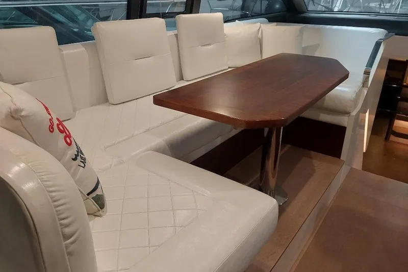 Slide: The Image of Luxurious interior of 2022 Fairline Targa 45 GT yacht with elegant seating and wooden table. - 11