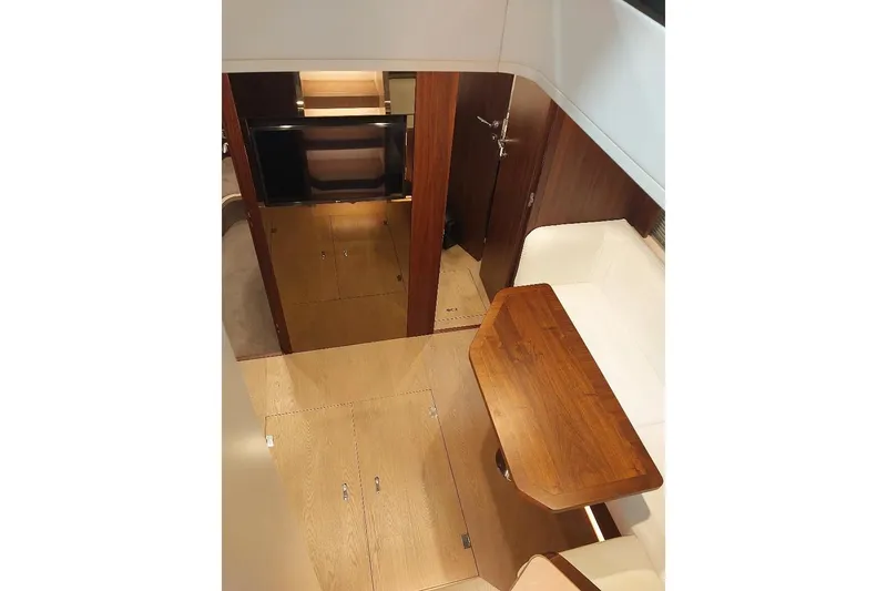 Slide: The Image of Interior of 2022 Fairline Targa 45 GT yacht with wooden flooring and seating area. - 12