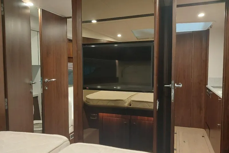 Slide: The Image of Interior of 2022 Fairline Targa 45 GT yacht with modern wood finish and TV. - 15