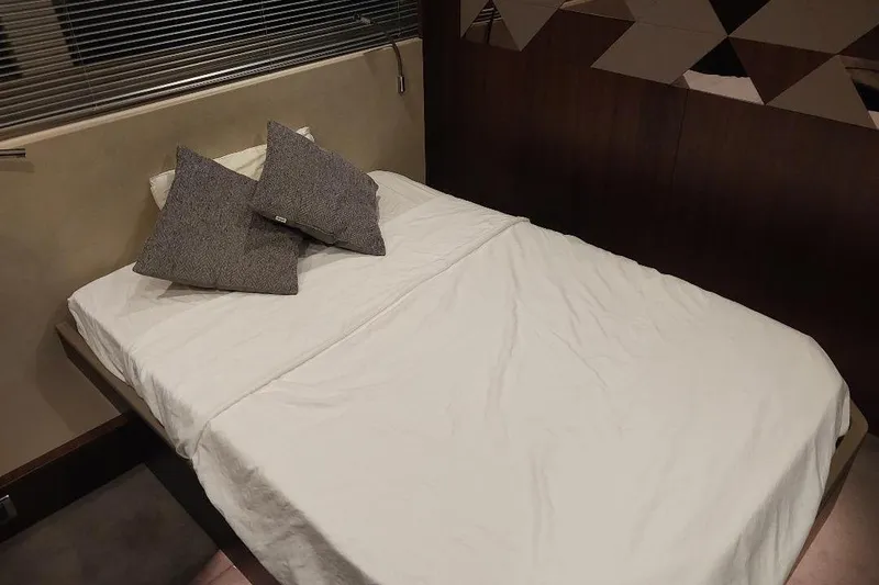 Slide: The Image of Interior cabin of 2022 Fairline Targa 45 GT yacht with bed and pillows. - 16