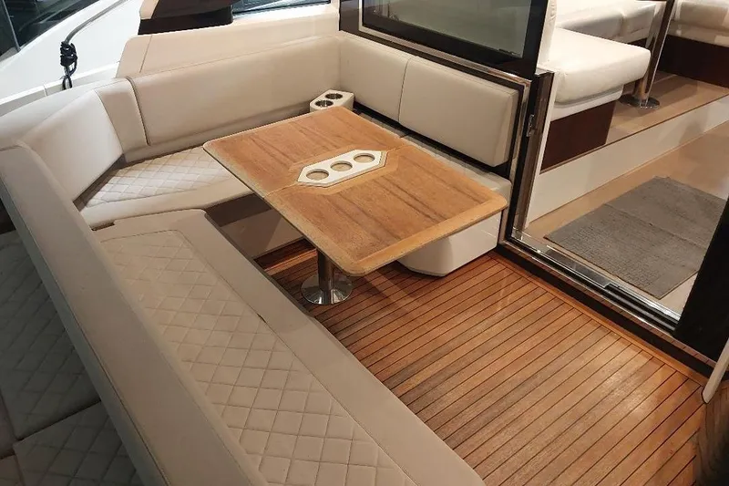 Slide: The Image of Luxurious interior of 2022 Fairline Targa 45 GT yacht with elegant seating and wooden table. - 2