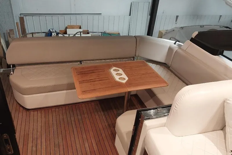 Slide: The Image of Interior of 2022 Fairline Targa 45 GT yacht with elegant seating and wooden table. - 3