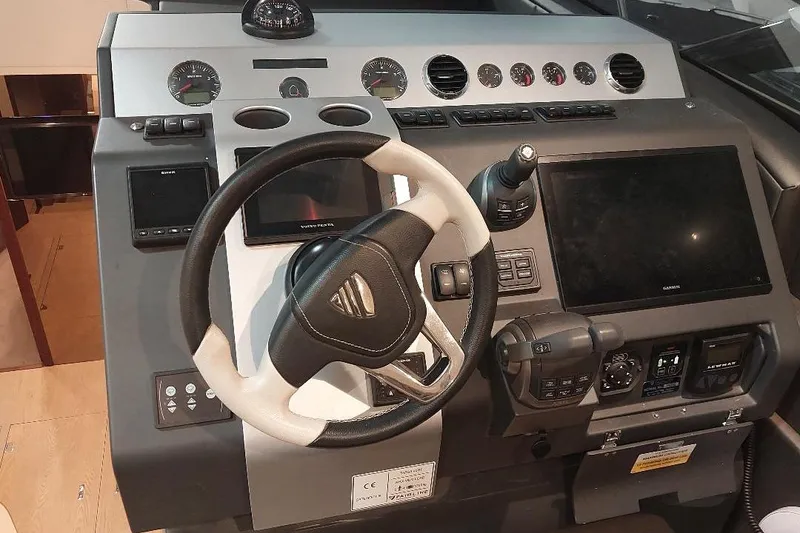 Slide: The Image of Cockpit of 2022 Fairline Targa 45 GT yacht with modern navigation controls. - 7