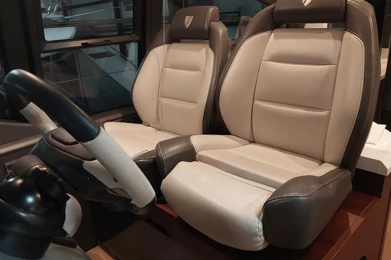 Slide: The Image of Luxury leather seats in the 2022 Fairline Targa 45 GT yacht cockpit. - 9
