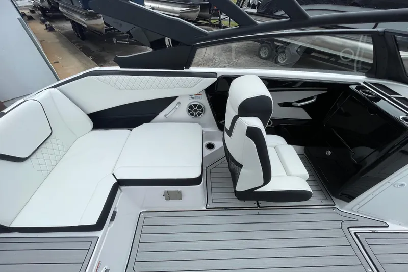 Slide: The Image of 2026 Yamaha Boats 222S interior with white seating and modern design. - 11