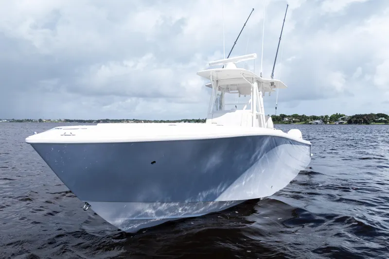 The Image of 2023 SeaVee 340Z boat with triple outboard engines on open water. - 0