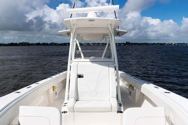 Slide: The Image of 2023 SeaVee 340Z boat on open water under cloudy sky. - 16