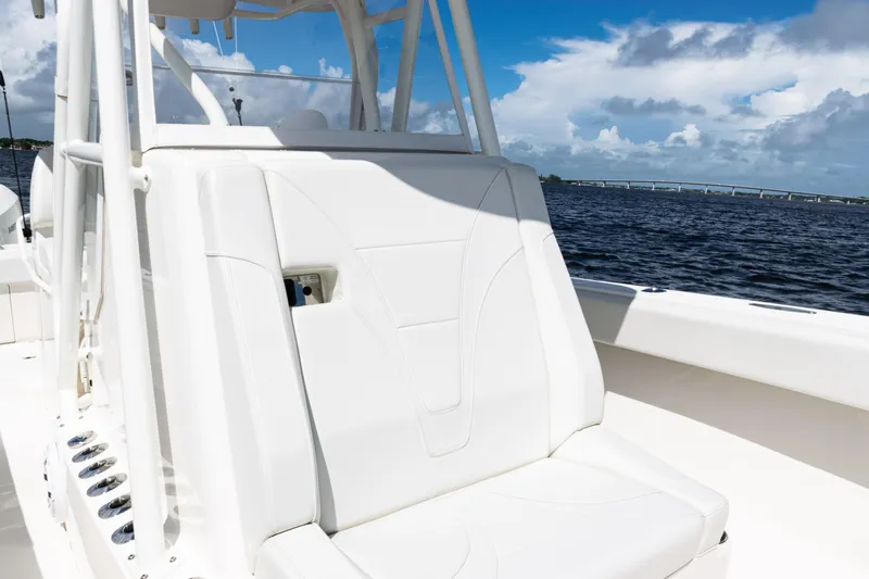 Slide: The Image of 2023 SeaVee 340Z boat interior with white seating, ocean view, and blue sky. - 19