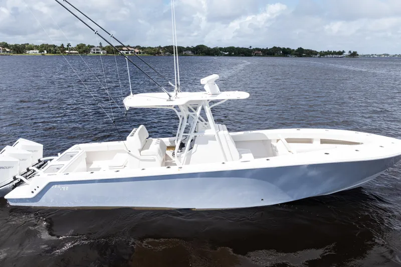 Slide: The Image of 2023 SeaVee 340Z boat on open water under cloudy sky. - 3