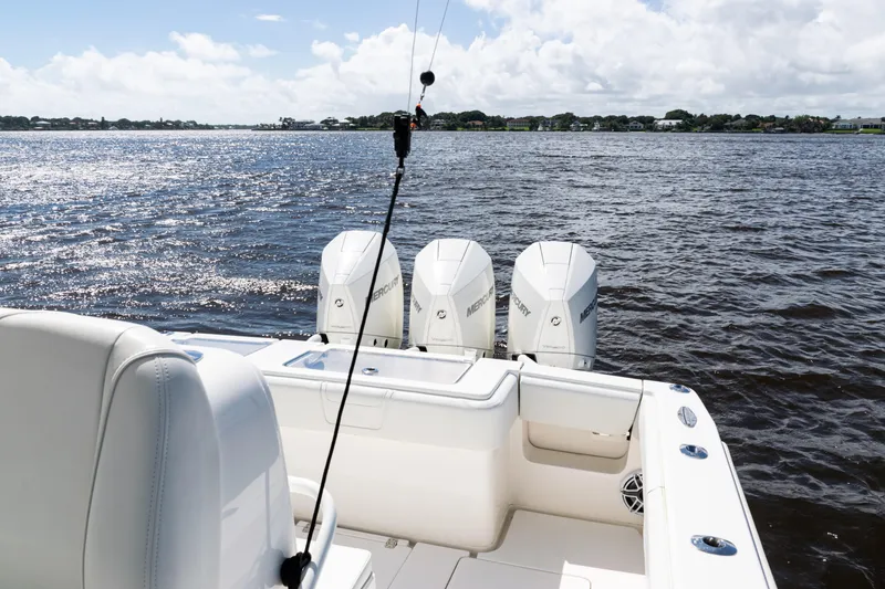 Slide: The Image of 2023 SeaVee 340Z boat with triple Mercury engines on a sunny day. - 30