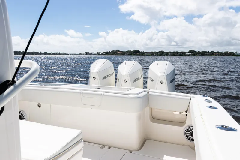Slide: The Image of 2023 SeaVee 340Z boat with triple Mercury engines on a sunny day. - 36
