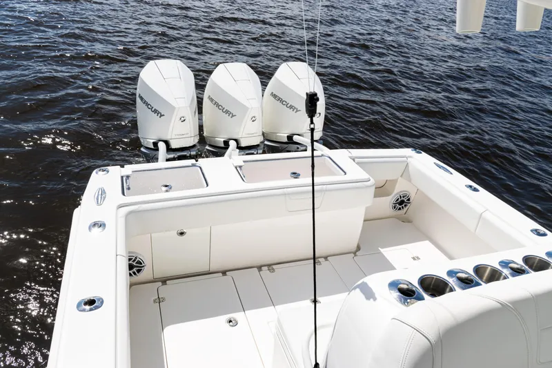 Slide: The Image of 2023 SeaVee 340Z boat with triple Mercury engines on open water. - 38