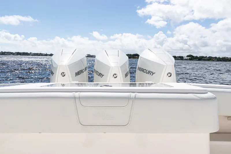 Slide: The Image of 2023 SeaVee 340Z boat with triple Mercury engines on a sunny day. - 39