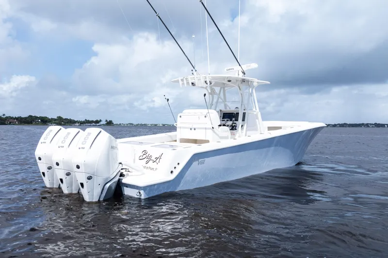 Slide: The Image of 2023 SeaVee 340Z boat on calm water, featuring sleek design and modern amenities. - 4