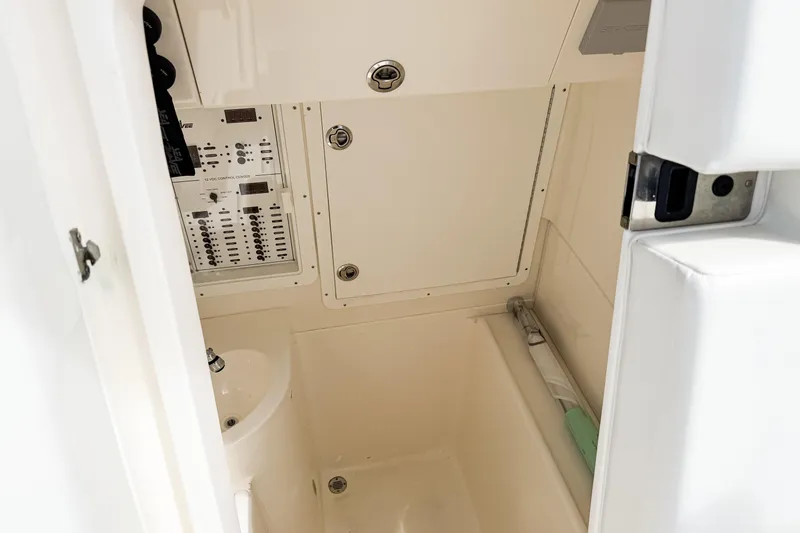 Slide: The Image of 2023 SeaVee 340Z interior with control panel and compact sink. - 44