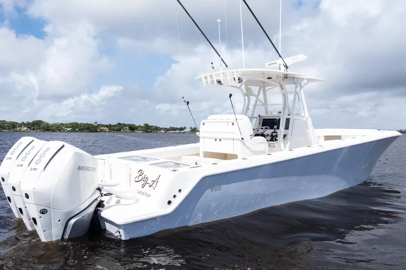 Slide: The Image of 2023 SeaVee 340Z boat with triple Mercury engines on calm water. - 45