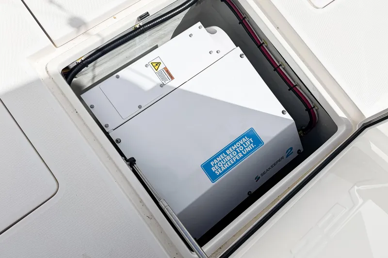 Slide: The Image of 2023 SeaVee 340Z boat featuring Seakeeper 2 stabilization unit in open compartment. - 5