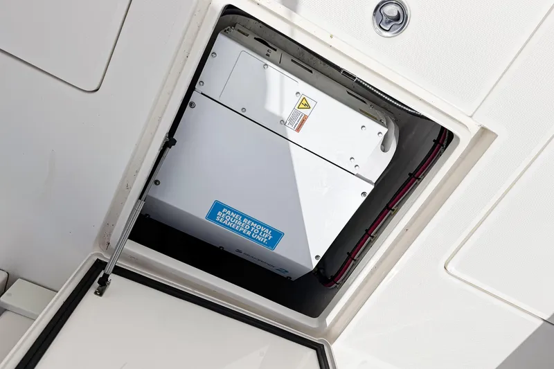 Slide: The Image of 2023 SeaVee 340Z boat compartment with Seakeeper unit visible. - 55