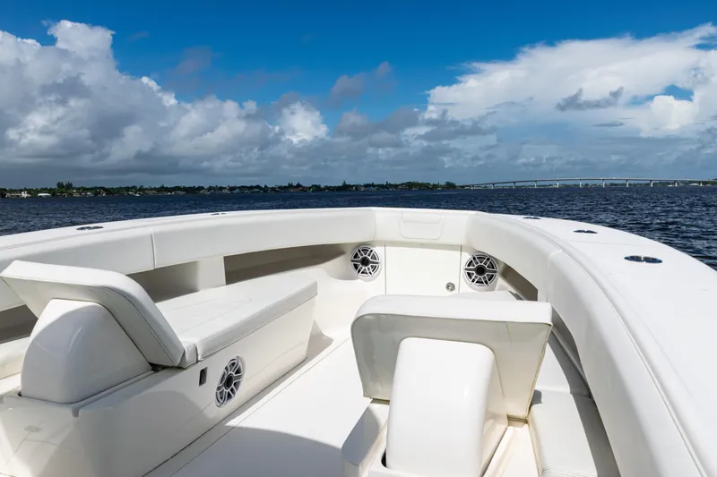 Slide: The Image of 2023 SeaVee 340Z boat interior with seating, speakers, and ocean view. - 7
