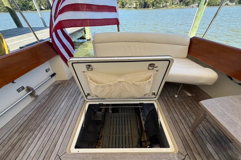 Slide: The Image of 2003 Hinckley Talaria 40 yacht deck with open hatch and American flag. - 24