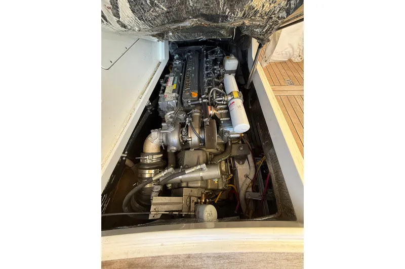 Slide: The Image of Engine compartment of a 2003 Hinckley Talaria 40 boat, showcasing detailed mechanical components. - 25