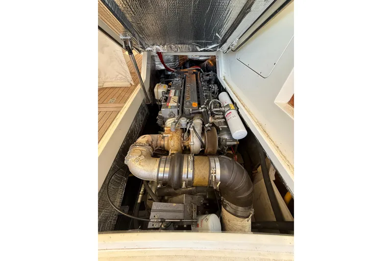 Slide: The Image of Engine compartment of 2003 Hinckley Talaria 40, showcasing detailed mechanical components. - 26