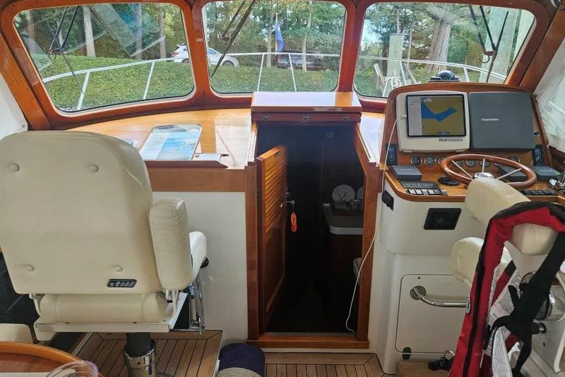 Slide: The Image of Interior of 2003 Hinckley Talaria 40 boat with navigation equipment and seating. - 5