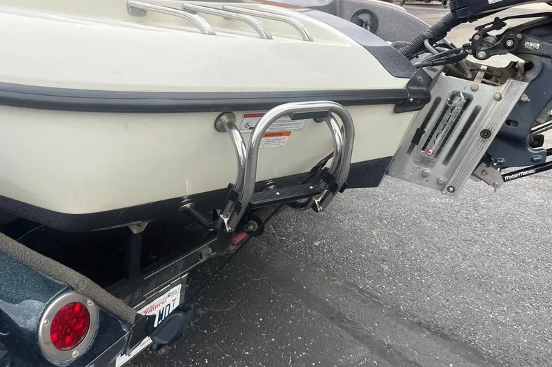 Slide: The Image of 2010 Ranger Z520 Comanche boat rear view with motor mount and ladder. - 3