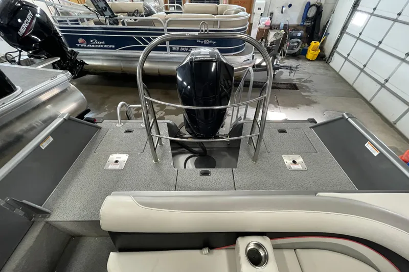Slide: The Image of Dashboard of 2021 Lowe Sport Deck 224 boat with gauges and controls. - 11