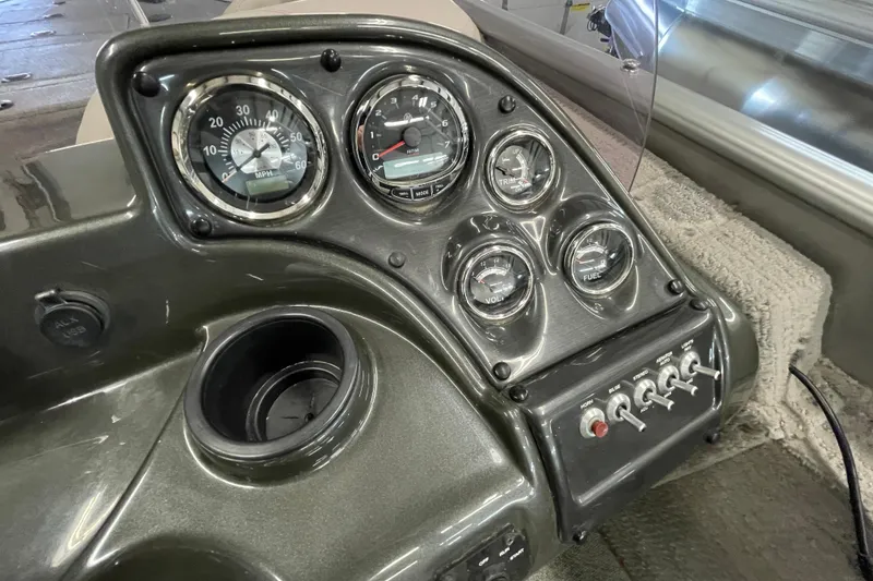 Slide: The Image of 2021 Lowe Sport Deck 224 boat interior with cushioned seating and gray flooring. - 13