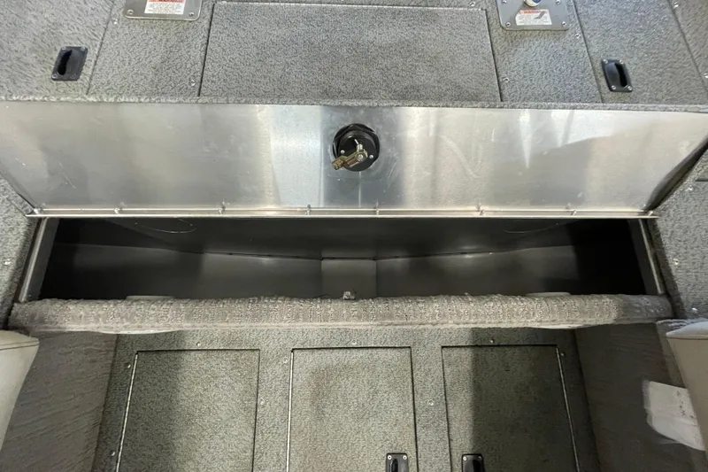 Slide: The Image of 2021 Lowe Sport Deck 224 interior with comfortable seating and storage compartments. - 14