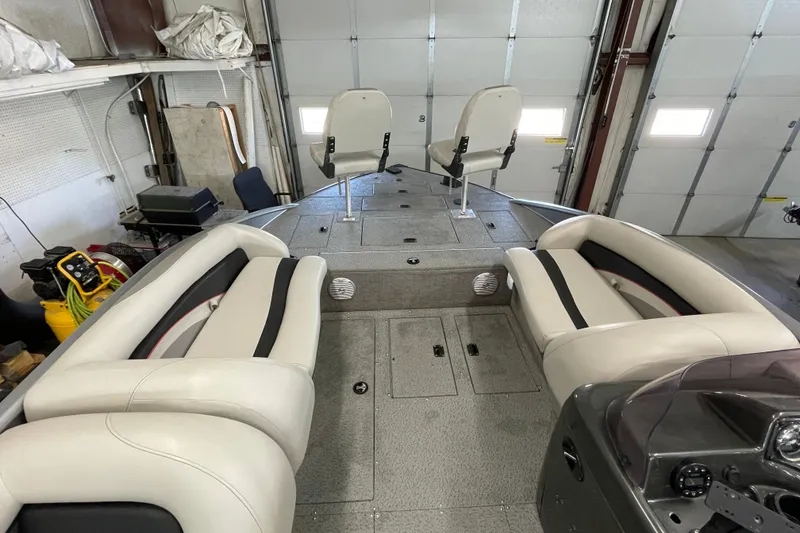 Slide: The Image of 2021 Lowe Sport Deck 224 boat interior with spacious seating and modern design. - 5