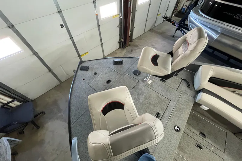 Slide: The Image of 2021 Lowe Sport Deck 224 boat interior with covered engine and seating area. - 8