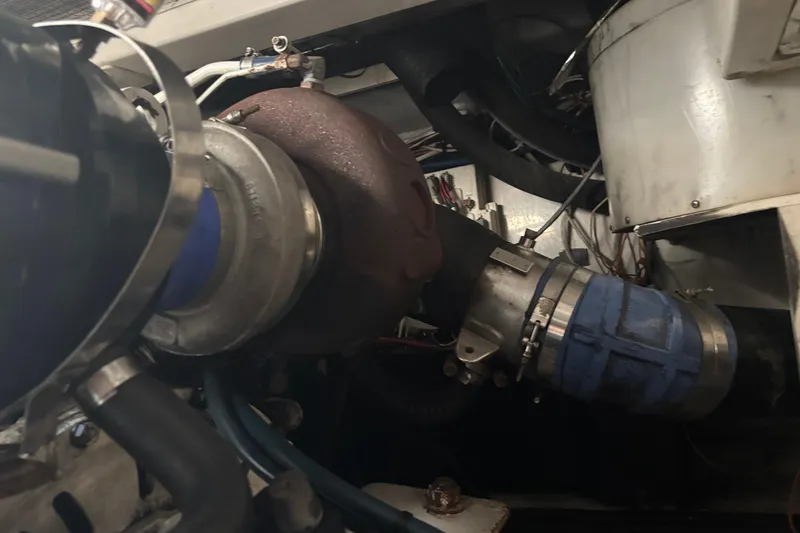 Slide: The Image of Engine compartment of a 2006 Rampage 38 Express boat, showcasing mechanical components. - 30