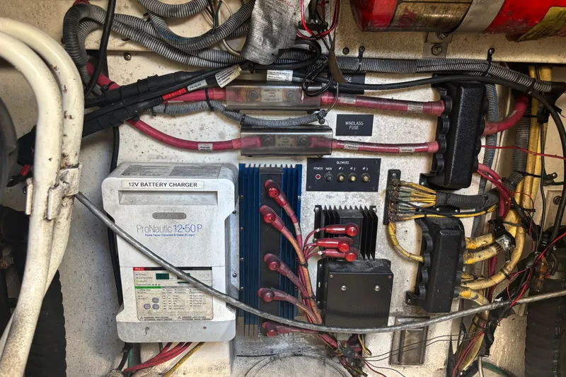 Slide: The Image of Electrical panel of a 2006 Rampage 38 Express boat with battery charger and wiring. - 31