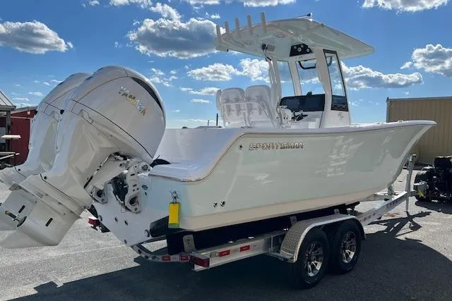 Slide: The Image of 2026 Sportsman Open 252 Center Console boat on trailer under blue sky. - 3