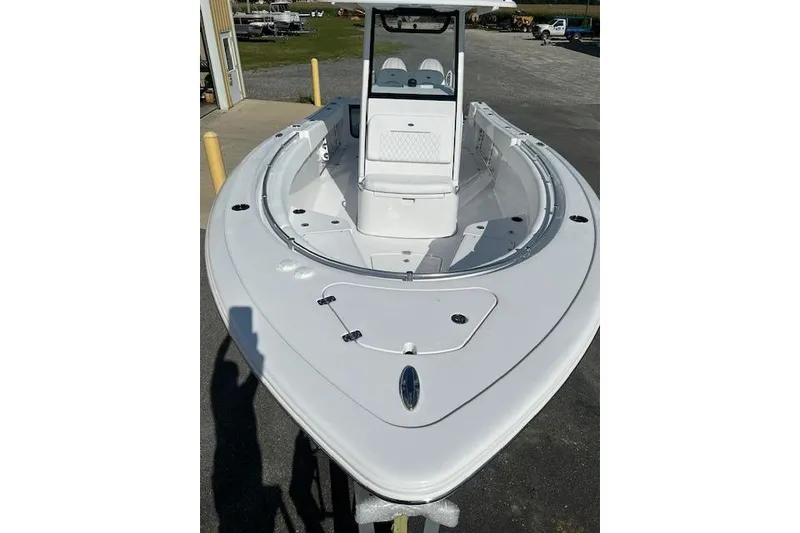 Slide: The Image of 2026 Sportsman Open 252 Center Console boat, white, docked outdoors. - 7
