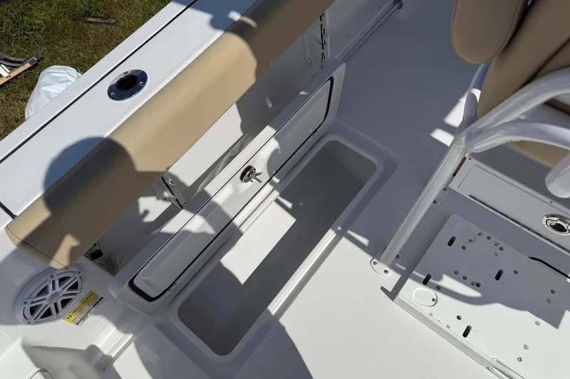 Slide: The Image of 2026 Sportsman Open 252 Center Console interior with storage compartments and seating. - 10