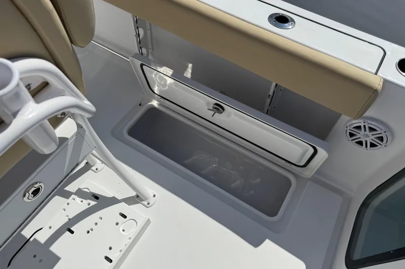 Slide: The Image of 2026 Sportsman Open 252 Center Console interior with storage compartment and seating. - 11