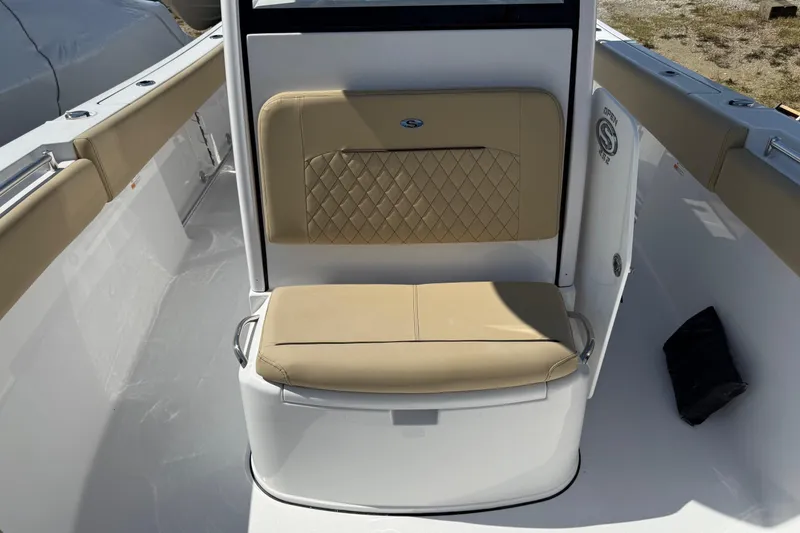 Slide: The Image of 2026 Sportsman Open 252 Center Console boat with tan cushioned seating. - 14