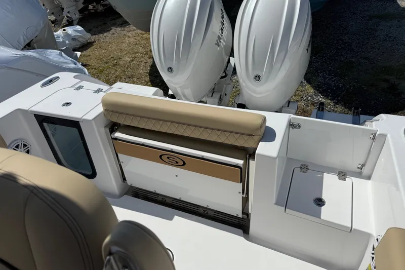 Slide: The Image of 2026 Sportsman Open 252 Center Console with dual Yamaha engines and tan seating. - 6