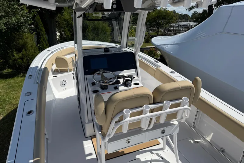 Slide: The Image of 2026 Sportsman Open 252 Center Console boat interior with helm and seating. - 8