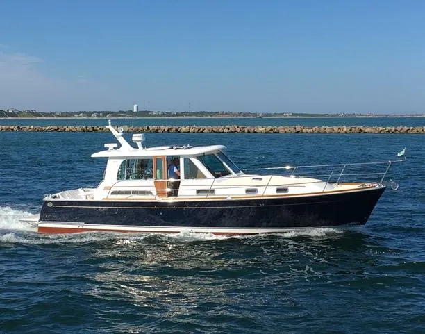 Slide: The Image of 2015 Sabre 42 Salon Express cruising on open water. - 0