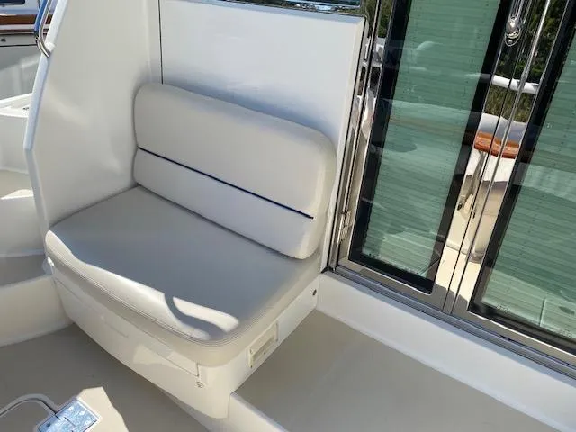 Slide: The Image of 2015 Sabre 42 Salon Express boat interior seating area. - 11