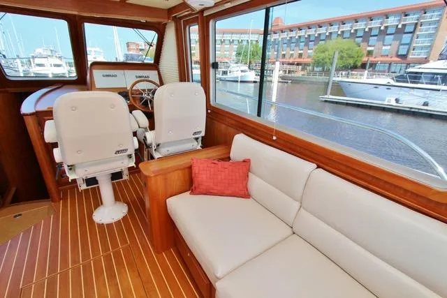 Slide: The Image of Interior of 2015 Sabre 42 Salon Express yacht with waterfront view. - 21