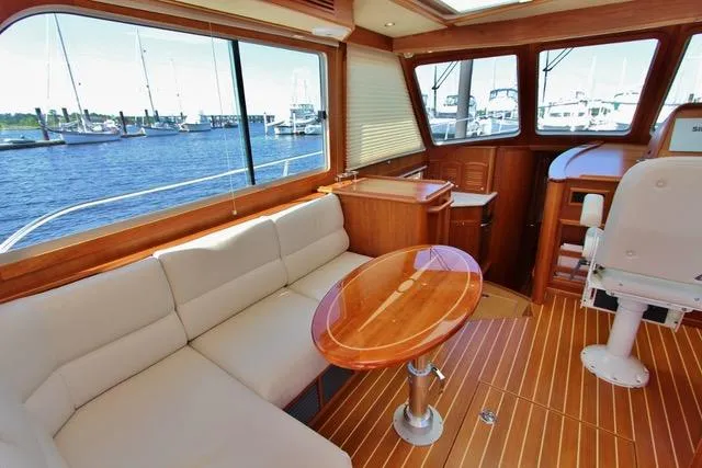 Slide: The Image of Interior of 2015 Sabre 42 Salon Express yacht with waterfront view. - 23