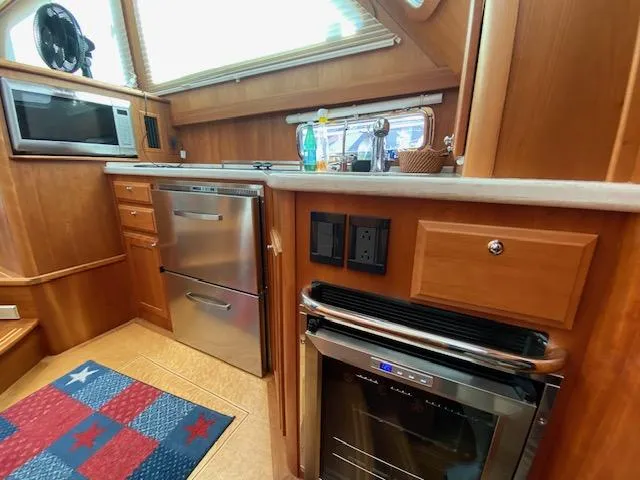 Slide: The Image of Interior kitchen of 2015 Sabre 42 Salon Express yacht with stainless steel appliances. - 24