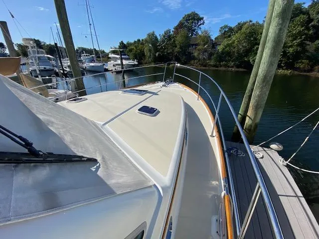 Slide: The Image of 2015 Sabre 42 Salon Express yacht docked at a marina. - 3